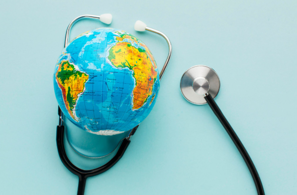 A globe surrounded by a stethoscope representing international health insurance and global medical coverage.
